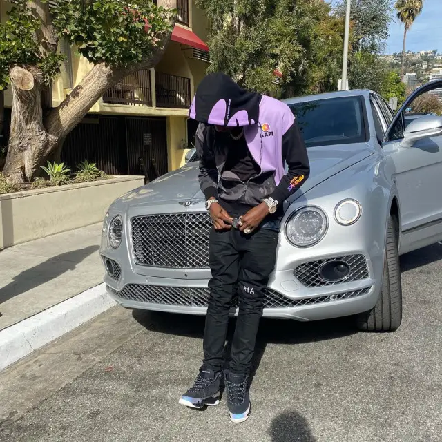 Lil Tjay outfit in Aape, Rta, and Louis Vuitton, 2020