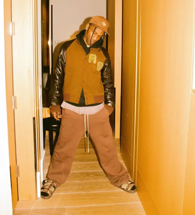 Travis Scott outfit in Raf Simons, Nike, and Travis Scott Merch, 2020