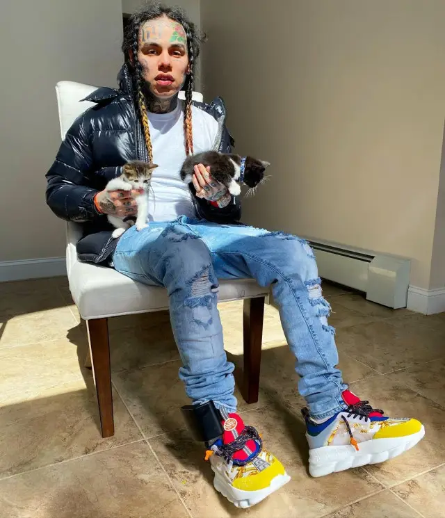 6ix9ine outfit in Moncler, H&M, and Versace, 2020
