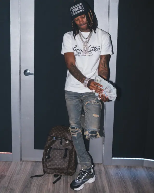 King Von outfit in Louis Vuitton, Amiri, and Chrome Hearts, 2020