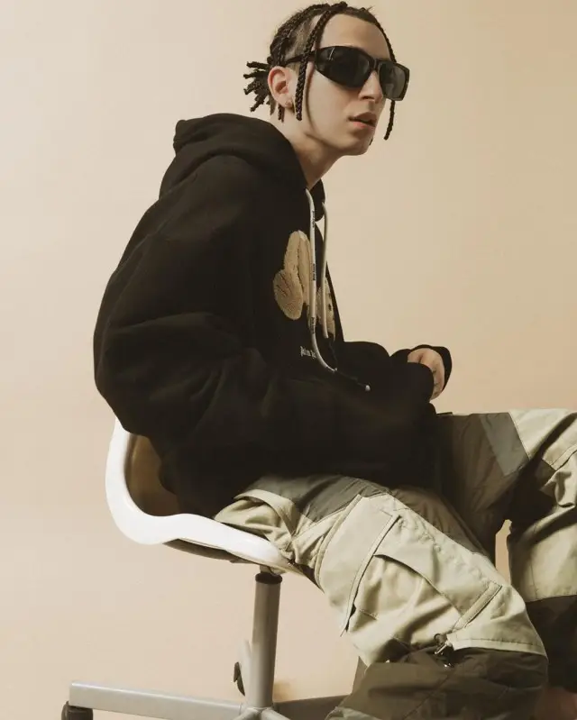 Yanix outfit in Palm Angels, Sacai, and Tom Ford, 2020