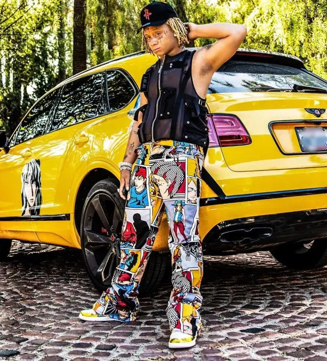 Trippie Redd outfit in Pretty Boy Larry Merch, New Era, and Dior, 2020