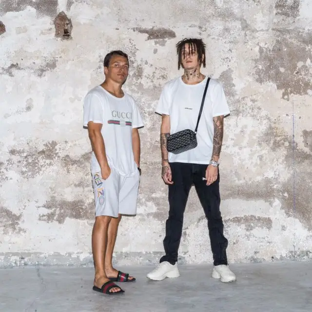 Kizaru outfit in Saint Laurent, Palm Angels, and Goyard, 2018