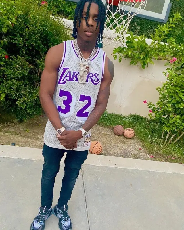 Polo G outfit in Mitchell & Ness, Purple Brand, and Louis Vuitton, 2020