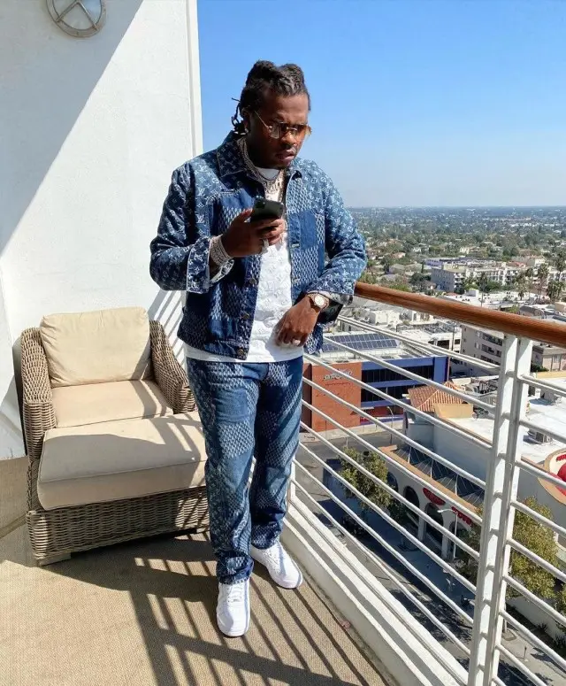 Gunna outfit in Louis Vuitton, Cartier, and Nigo, 2020