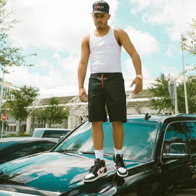 Myke Towers outfit in Jordan, Supreme, and Hanes, 2020