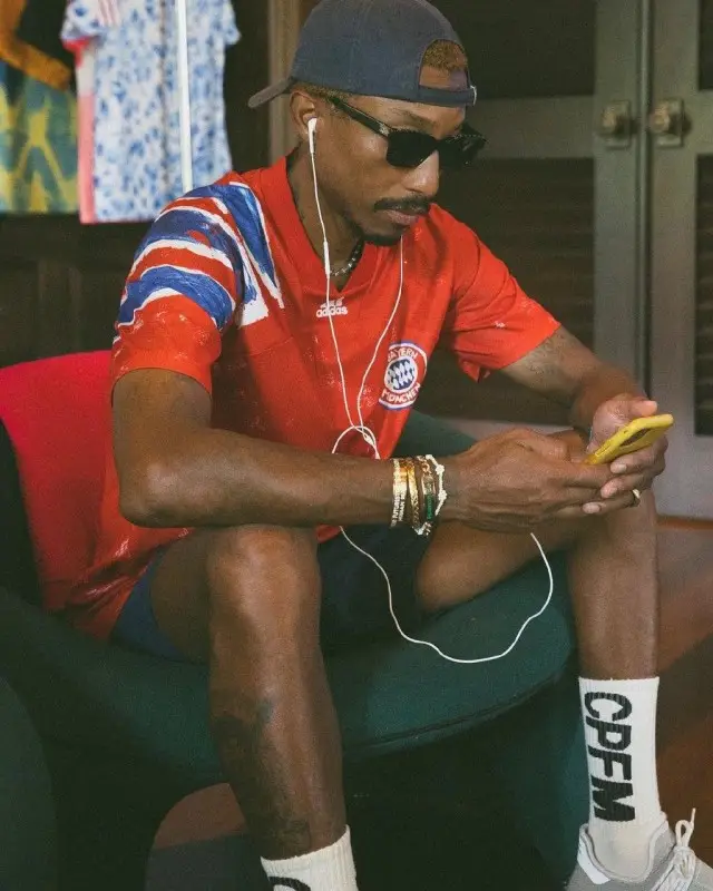 Pharrell Williams outfit in Adidas, Chanel, and Human Made, 2020