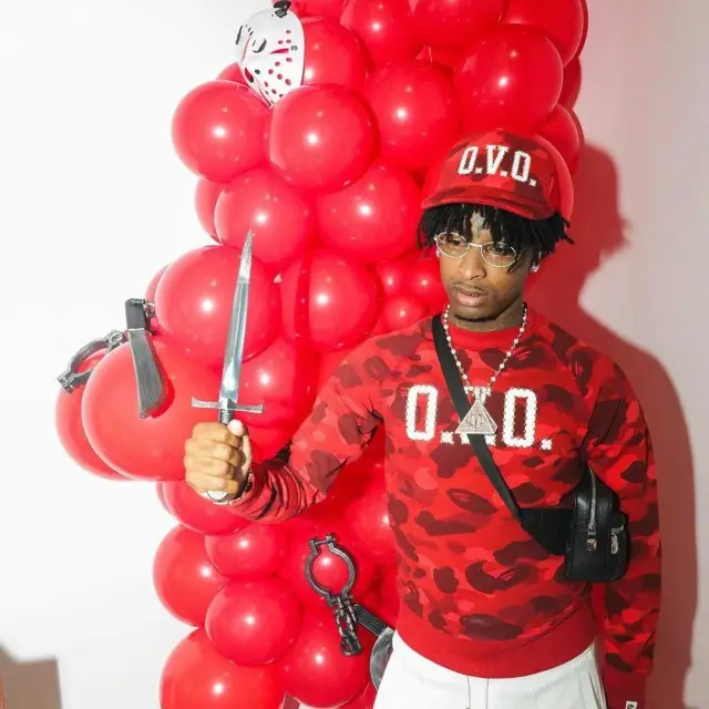 21 Savage outfit in Bape, OVO, and Louis Vuitton, 2020