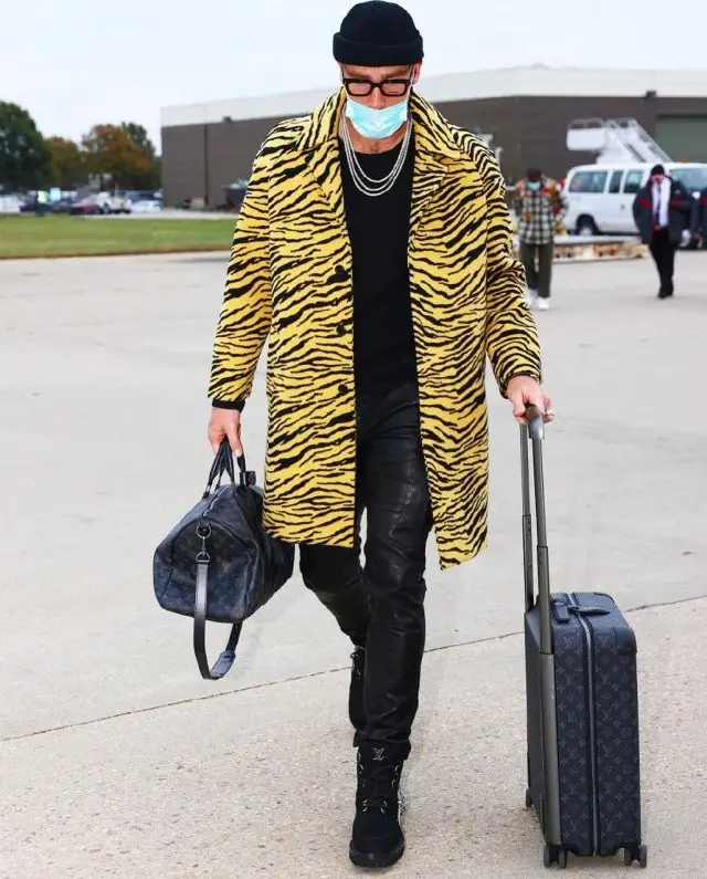 Travis Kelce outfit in Celine, Amiri, and Louis Vuitton, 2020