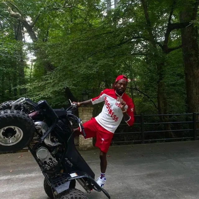 Meek Mill outfit in Supreme, New Era, and Dream Chasers, 2020