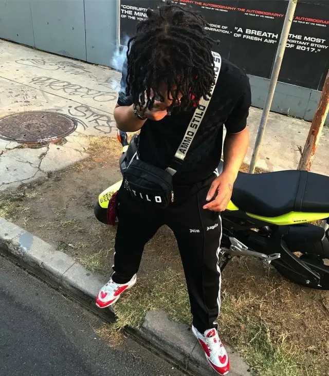 Trippie Redd outfit in Supreme, Palm Angels, and Ammo Stilo, 2018