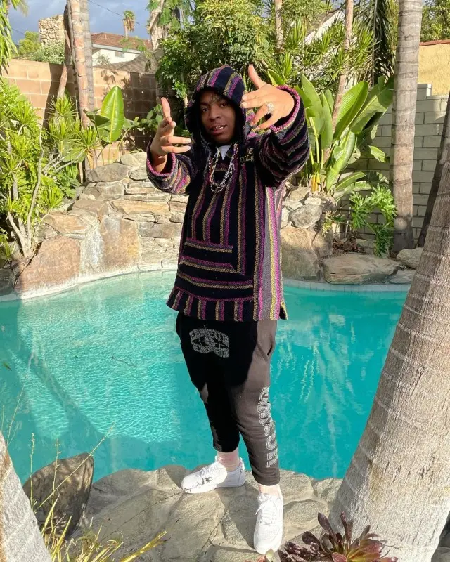 Lil Gotit outfit in Clever Fools, Erreur, and Nike, 2020