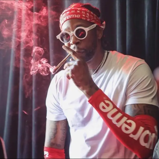 2 Chainz outfit in Supreme, Louis Vuitton, and Nike, 2020
