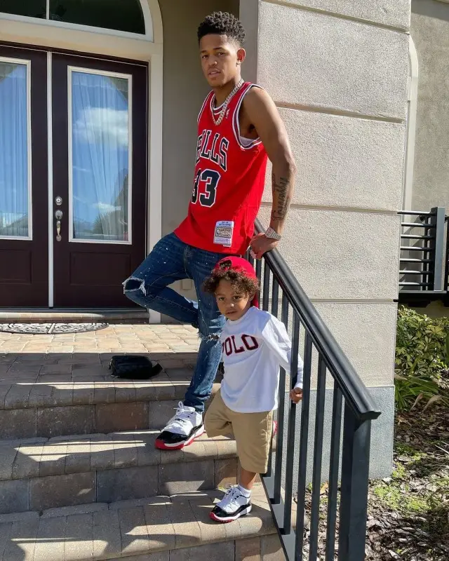 YK Osiris outfit in Mitchell & Ness, Jordan, and Louis Vuitton, 2020
