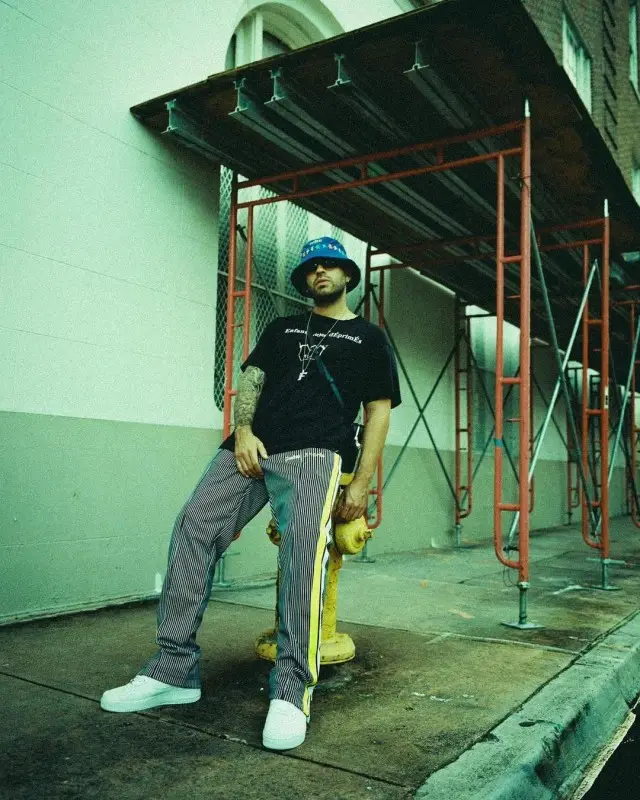 Feid outfit in Enfants Riches Deprimes, Nike, and Grateful Dead, 2020