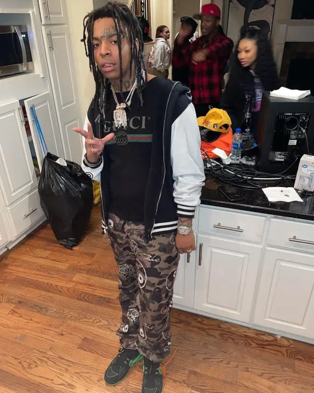 Lil Gotit outfit in Gucci, Bape, and Nike, 2020