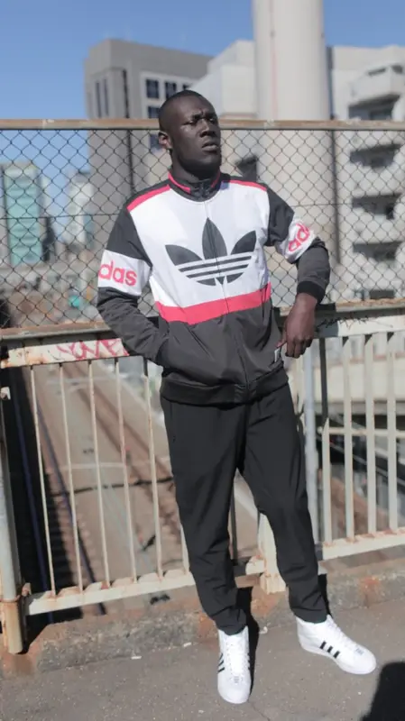 Stormzy outfit in Adidas and Nigo, 2016