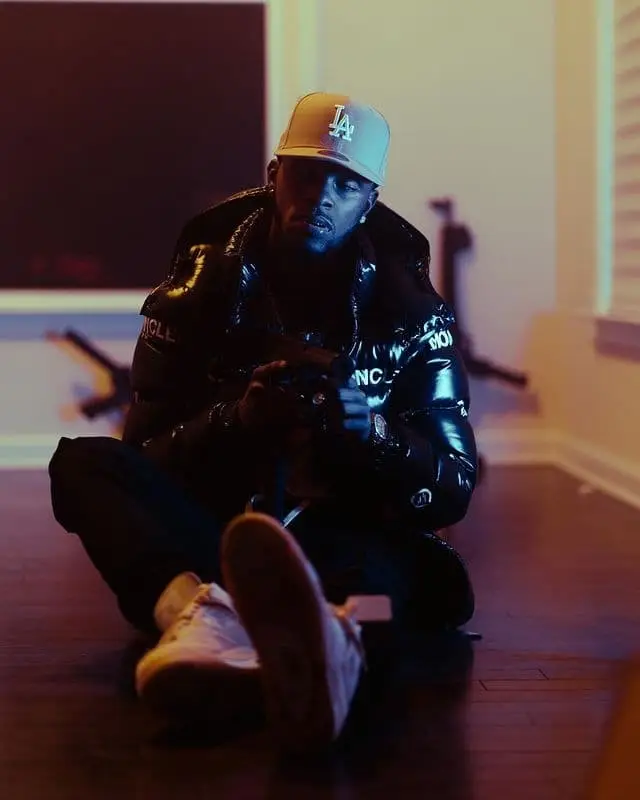 Toosii outfit in Moncler, Jordan, and New Era, 2020