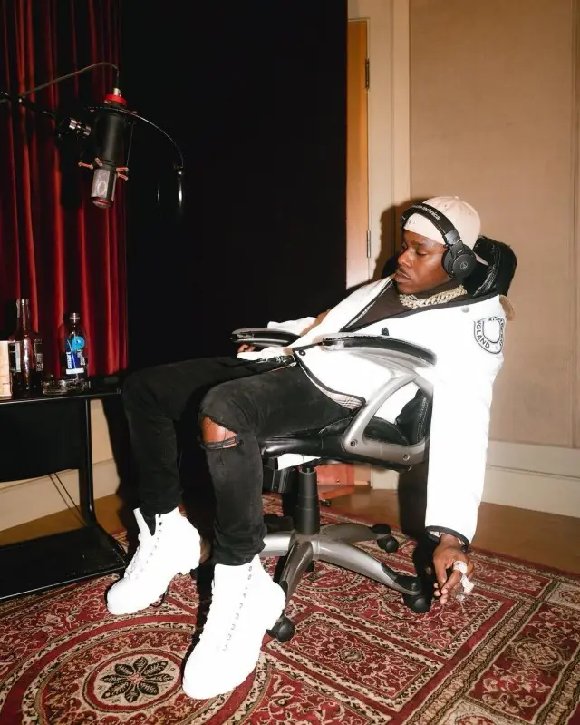 DaBaby outfit in Burberry, Audio Technica, and Cartier, 2020