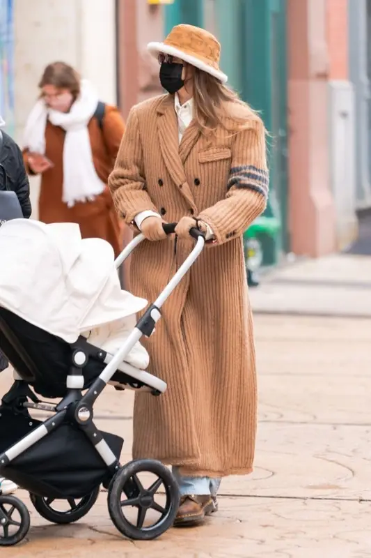 Gigi Hadid outfit in Thom Browne, Dr. Martens, and Louis Vuitton, 2020